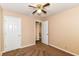 This bedroom features neutral walls, a ceiling fan, and closet space for comfortable living at 392 Aspen Dr, Carmel, IN 46032