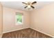 Bedroom with a window, neutral paint, and a ceiling fan at 392 Aspen Dr, Carmel, IN 46032
