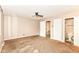 Bedroom with a ceiling fan, carpet, and a view to the attached bathroom at 392 Aspen Dr, Carmel, IN 46032