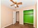 Bedroom features a ceiling fan and spacious closet, perfect for storage and organization at 392 Aspen Dr, Carmel, IN 46032
