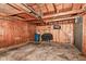 Empty garage interior with concrete floor and wood paneling at 392 Aspen Dr, Carmel, IN 46032