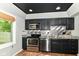 This renovated kitchen has stainless steel appliances, granite countertops and a modern backsplash at 392 Aspen Dr, Carmel, IN 46032