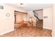 View of the living room featuring tile floors, stairs to the second level, and stairs to a lower level at 392 Aspen Dr, Carmel, IN 46032