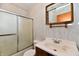 Bathroom with tiled walls, sliding glass doors for the shower, and a vanity with a sink at 415 N 3Rd St, Elwood, IN 46036