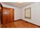 Bedroom featuring hardwood floors, closet, and a window with natural light at 415 N 3Rd St, Elwood, IN 46036