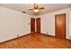 Bedroom featuring hardwood floors and multiple doorways at 415 N 3Rd St, Elwood, IN 46036