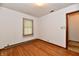 Bright bedroom featuring hardwood floors and a window with natural light at 415 N 3Rd St, Elwood, IN 46036