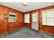 Inviting living room showcasing wood paneling, natural light, and classic design elements at 415 N 3Rd St, Elwood, IN 46036