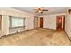 Bright living room with a ceiling fan and natural lighting at 415 N 3Rd St, Elwood, IN 46036