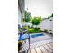 Private backyard with a small lawn, a patio area with furniture, and a well-maintained fence at 4305 W Coyote Run Ct, Muncie, IN 47304