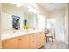 Elegant bathroom with double vanity, quartz countertops, and walk-in shower at 4305 W Coyote Run Ct, Muncie, IN 47304