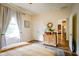 Bedroom with hardwood floors, area rug, ensuite access, and dresser at 4305 W Coyote Run Ct, Muncie, IN 47304