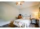 Cozy bedroom features a decorative ceiling fan and a plush bed with stylish furnishings at 4305 W Coyote Run Ct, Muncie, IN 47304