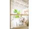 Cozy enclosed porch with seating, perfect for relaxation and enjoying the outdoors at 4305 W Coyote Run Ct, Muncie, IN 47304