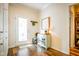 Inviting entryway featuring beautiful hardwood floors, storage cabinets, and a door to the exterior at 4305 W Coyote Run Ct, Muncie, IN 47304