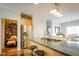 Open kitchen with granite counters, a breakfast bar and seating at 4305 W Coyote Run Ct, Muncie, IN 47304