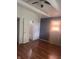 Bedroom with hardwood floors, ceiling fan, and closet at 4521 Vernon Ave, Indianapolis, IN 46226