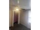 Bedroom featuring neutral walls and carpet, a ceiling fan, and an open closet with pink wall at 4521 Vernon Ave, Indianapolis, IN 46226