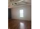Bright bedroom showcasing hardwood floors and a large window at 4521 Vernon Ave, Indianapolis, IN 46226