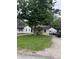 Charming home with lush green grass, mature trees, a front porch, and a long driveway at 4521 Vernon Ave, Indianapolis, IN 46226