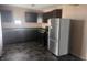 Features dark cabinetry, stainless steel appliances and tiled floor at 4521 Vernon Ave, Indianapolis, IN 46226