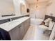 Spacious bathroom with a double vanity, soaking tub, and modern fixtures at 4635 Stansbury Ct, Indianapolis, IN 46254
