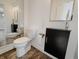 Half bathroom with white and black features at 4635 Stansbury Ct, Indianapolis, IN 46254