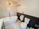 Bathroom features a modern soaking tub, separate toilet, and neutral design at 4635 Stansbury Ct, Indianapolis, IN 46254