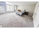 Spacious bedroom with plush carpeting, a large window for natural light, and neutral paint at 4635 Stansbury Ct, Indianapolis, IN 46254