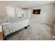 Bedroom featuring plush carpeting, neutral walls, ceiling mounted lighting, and closet storage at 4635 Stansbury Ct, Indianapolis, IN 46254