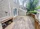 Outdoor deck with space for lounging, accessible from the home via a glass door at 4635 Stansbury Ct, Indianapolis, IN 46254