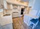Modern kitchen featuring stainless steel appliances, light cabinets, and a breakfast bar at 4635 Stansbury Ct, Indianapolis, IN 46254