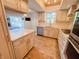 Bright kitchen showcasing updated appliances, light cabinets, and an island at 4635 Stansbury Ct, Indianapolis, IN 46254