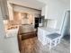 Well-lit kitchen with stainless steel appliances, granite countertops, and a breakfast bar at 4635 Stansbury Ct, Indianapolis, IN 46254