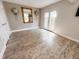 Bright room featuring beautiful hardwood floors, wall sconces, and a large mirror at 4635 Stansbury Ct, Indianapolis, IN 46254