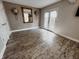 Living room featuring hard wood floors, mirror and sconces at 4635 Stansbury Ct, Indianapolis, IN 46254