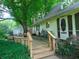 Backyard deck featuring bench seating and a view of the lush greenery, creating a serene outdoor experience at 4747 Guion Rd, Indianapolis, IN 46254