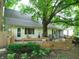 Spacious backyard deck is perfect for entertaining, with a wraparound bench and direct access to the home at 4747 Guion Rd, Indianapolis, IN 46254