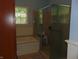 Bathroom featuring a tub and shower stall with glass door at 4747 Guion Rd, Indianapolis, IN 46254