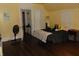 Bedroom featuring hardwood floors and soft natural light at 4747 Guion Rd, Indianapolis, IN 46254