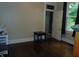 Bright bedroom featuring hardwood floors, neutral walls, and an adjacent bathroom at 4747 Guion Rd, Indianapolis, IN 46254