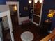 Charming foyer with hardwood floors, vintage lighting, and a cozy bench at 4747 Guion Rd, Indianapolis, IN 46254
