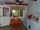 Kitchen with breakfast table and view of back yard through window with curtain valence at 4747 Guion Rd, Indianapolis, IN 46254