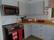 Cozy kitchen featuring modern stainless steel appliances, painted cabinets, and butcher block countertops at 4747 Guion Rd, Indianapolis, IN 46254