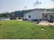 Spacious backyard featuring a patio with outdoor dining and seating, an above-ground pool and a scenic view at 4815 N 500 W, Columbus, IN 47201