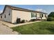 Charming single-story home featuring green shutters, lovely landscaping, and a cozy front porch at 4815 N 500 W, Columbus, IN 47201