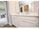Bathroom featuring double vanity with quartz countertop and wood-look tile floor at 4832 W Safford Dr, New Palestine, IN 46163