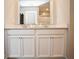Bathroom featuring double sinks with granite countertops and white cabinets at 4832 W Safford Dr, New Palestine, IN 46163