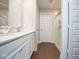 Bright bathroom features a double sink vanity, wood-look tile flooring and walk-in shower at 4832 W Safford Dr, New Palestine, IN 46163