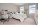 Comfortable bedroom featuring a desk, two windows, and neutral decor at 4832 W Safford Dr, New Palestine, IN 46163